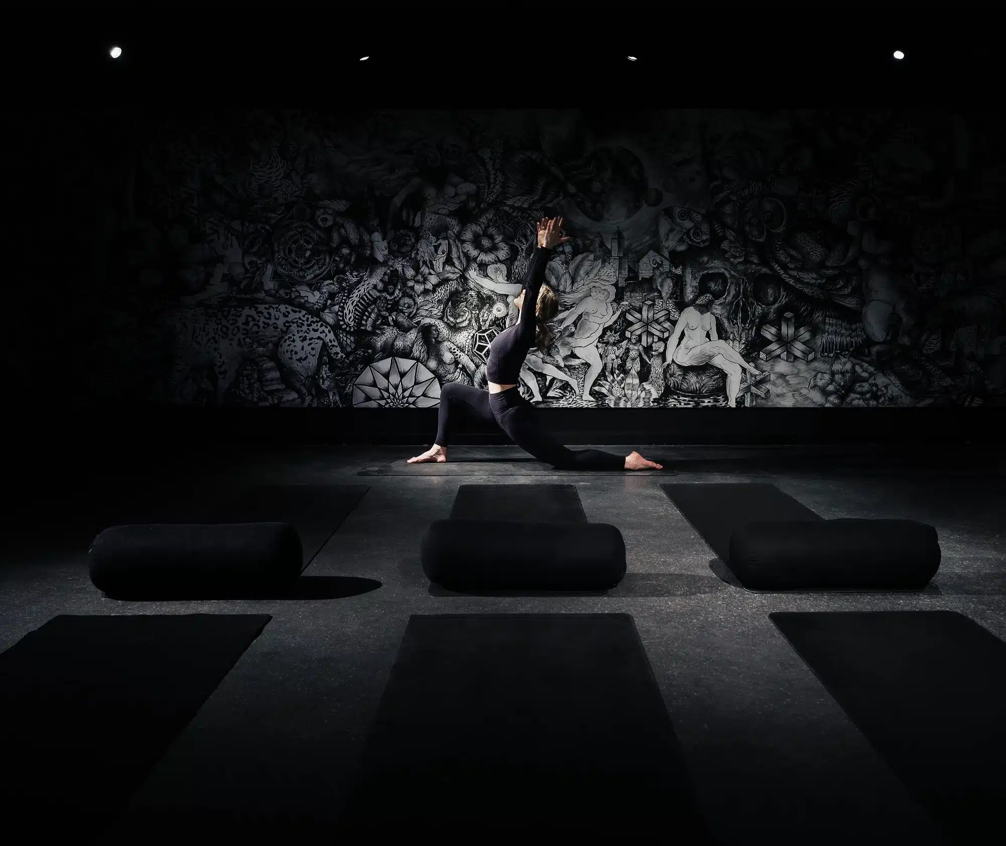 slow yoga in a black room